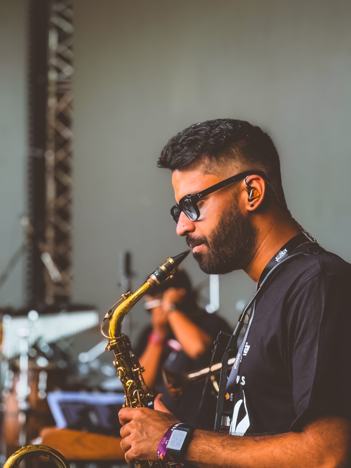 RJT playing saxophone at festival